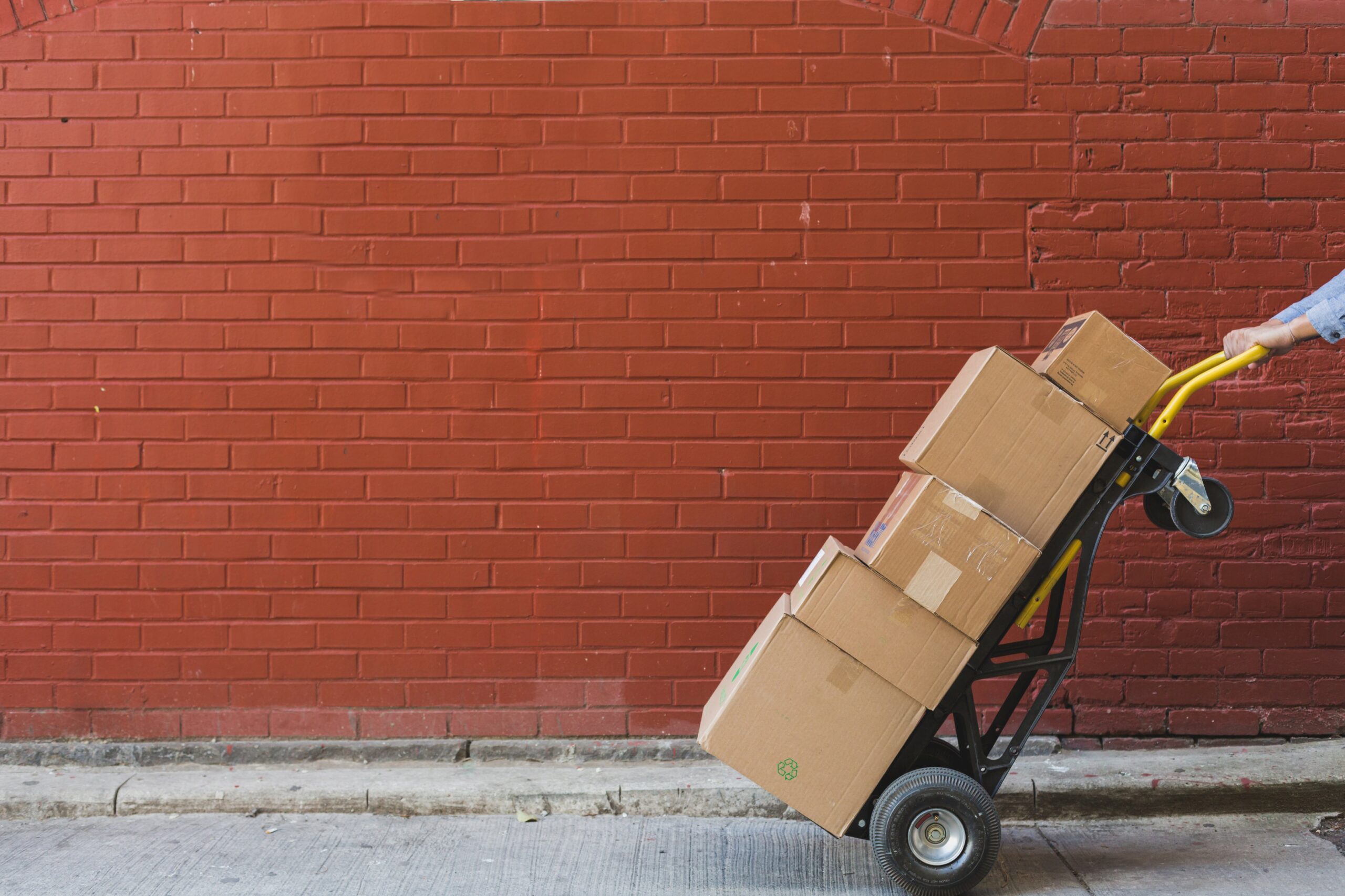 shipping-boxes-in-front-of-red-brick shipping-boxes-in-front-of-red-brick